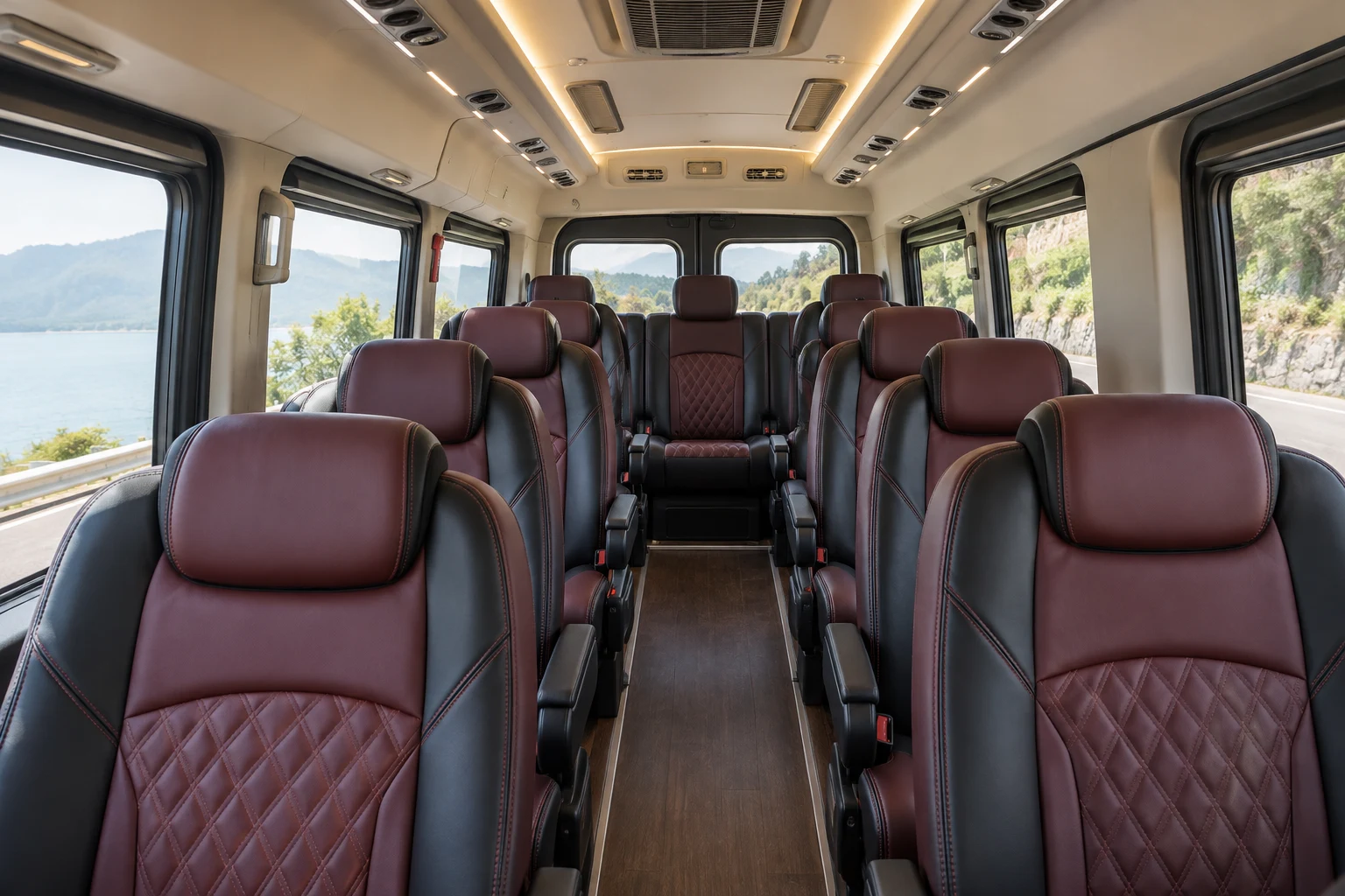 Illustrative Urbania cabin with burgundy reclining seats and central aisle